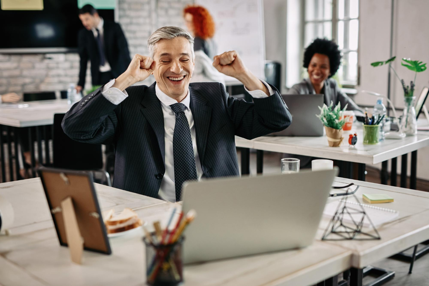 Happy businessman celebrating success